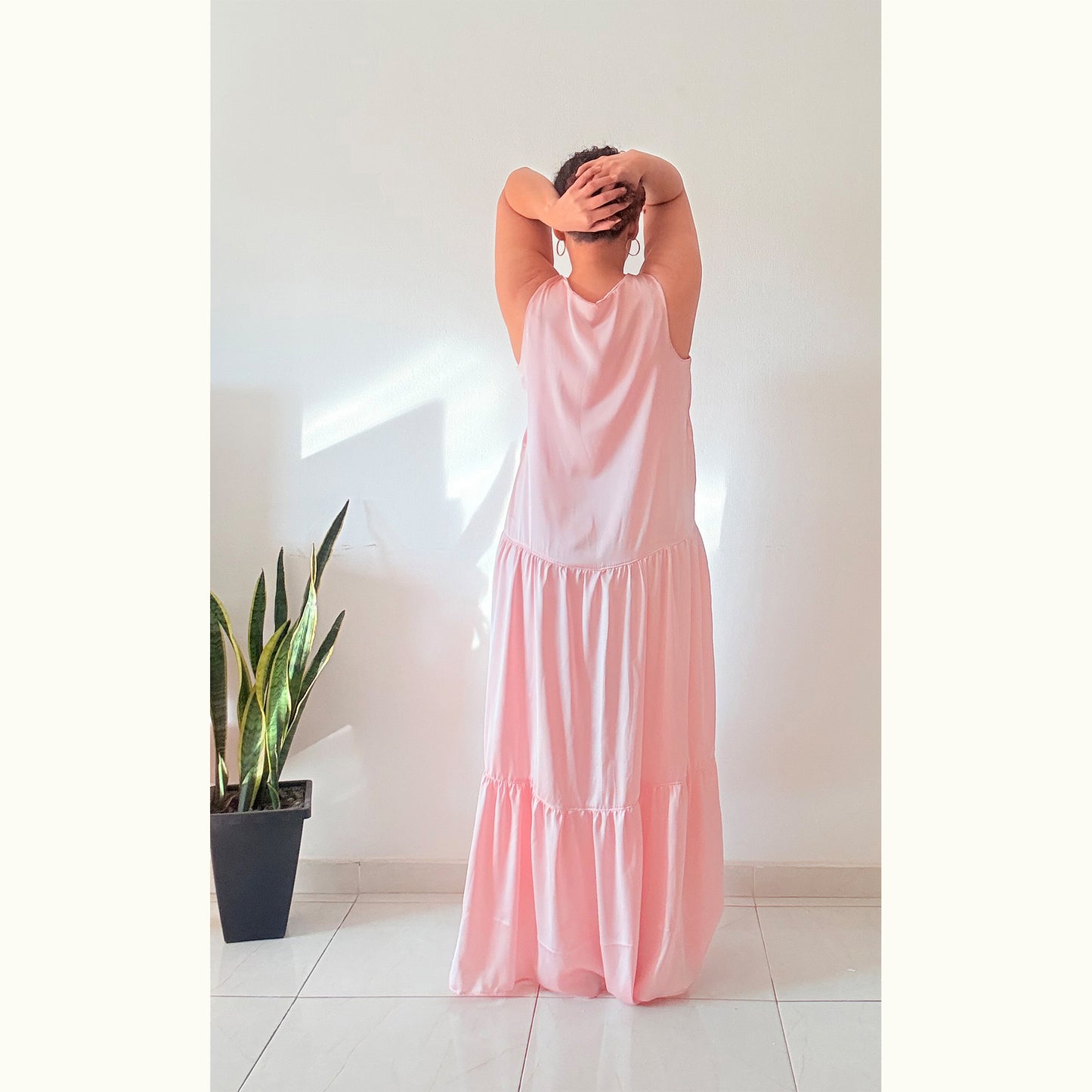 Back view of pink Blossom Tank maxi dress showing tiered skirt details