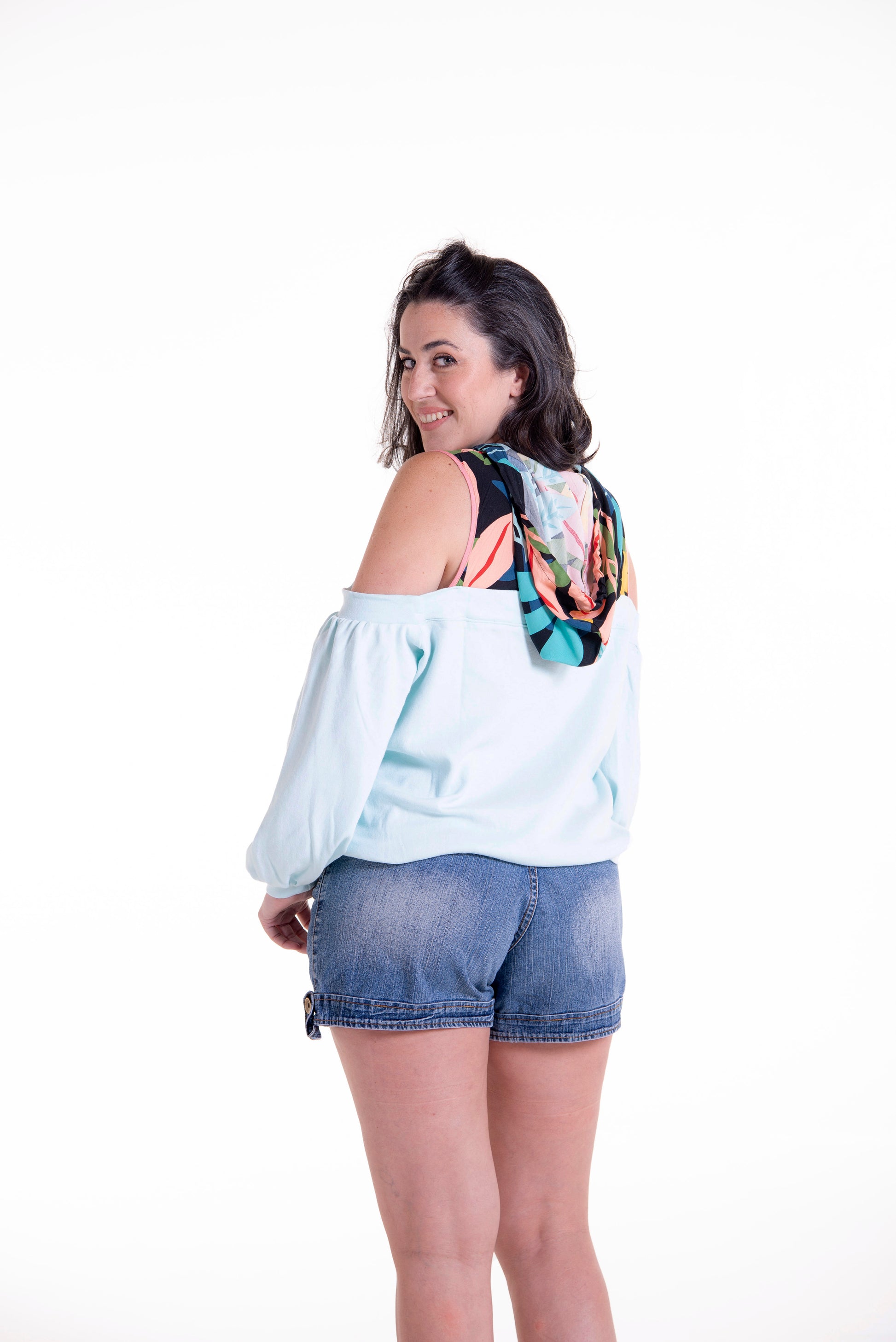 cold shoulder hoodie with waistband and bishop sleeve from back view
