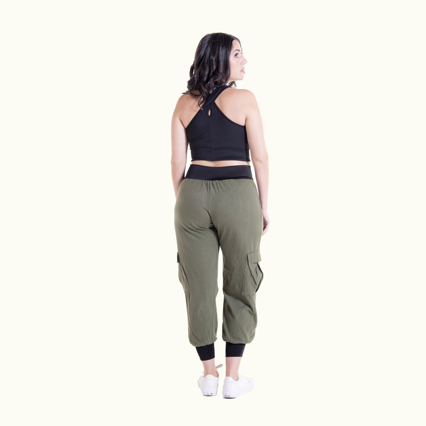 Back view of olive green Flax cargo pants showing pockets and fit