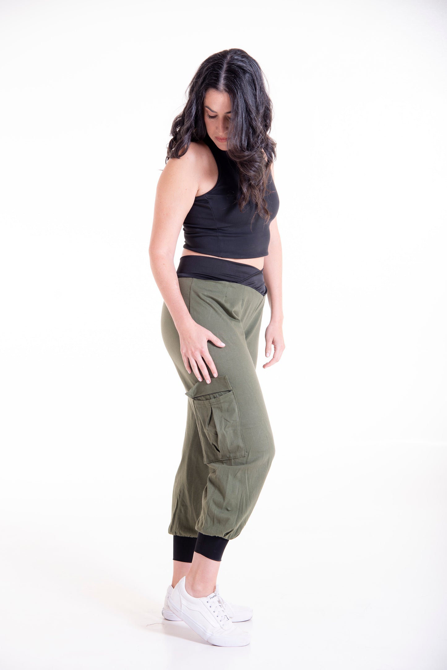 Side view of olive green Flax cargo pants - full length styling