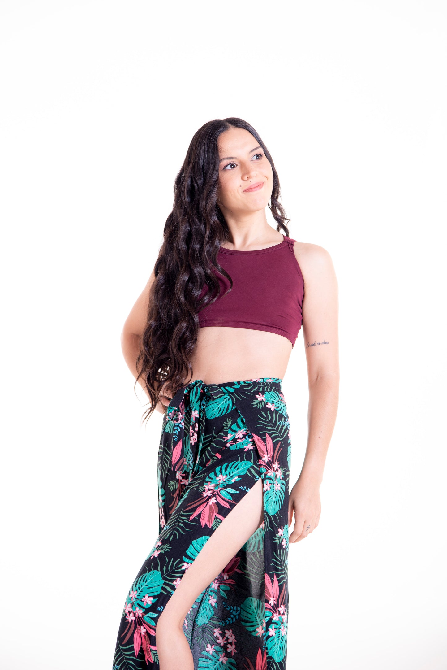 Side view of floral print Ivy wrap pants showing wrap and slit detail