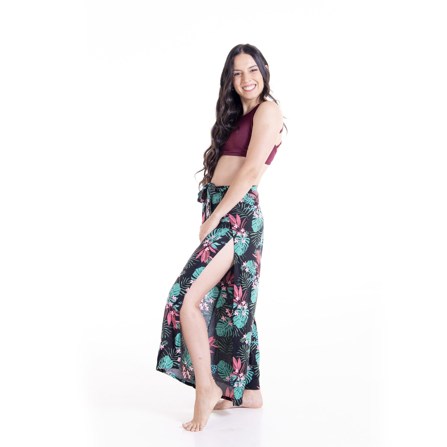 Woman wearing floral print Ivy wrap pants showing side slit detail - sewing pattern by The Bobbin Bloom