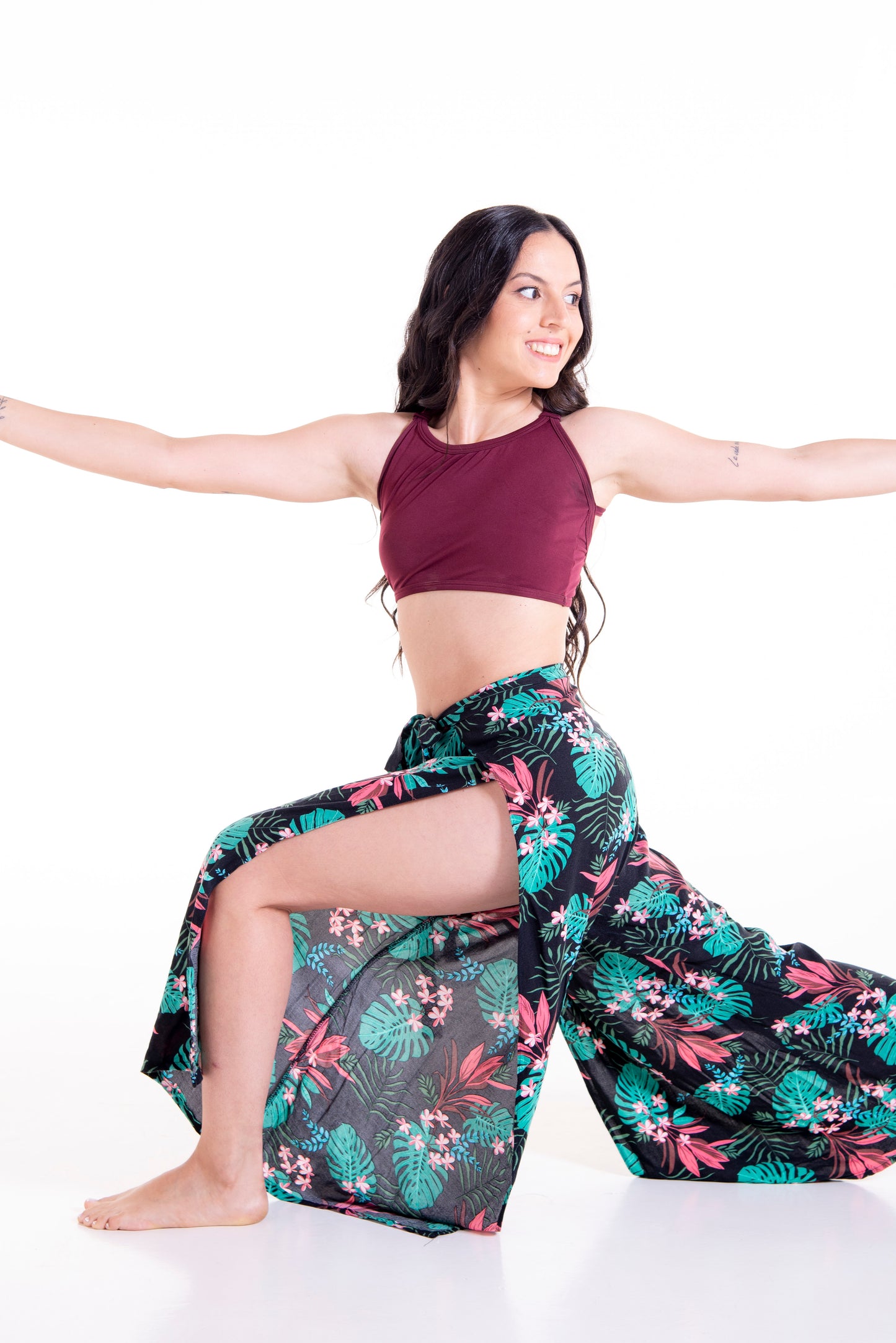Front view of floral print Ivy wrap pants in yoga pose - activewear versatility showcase