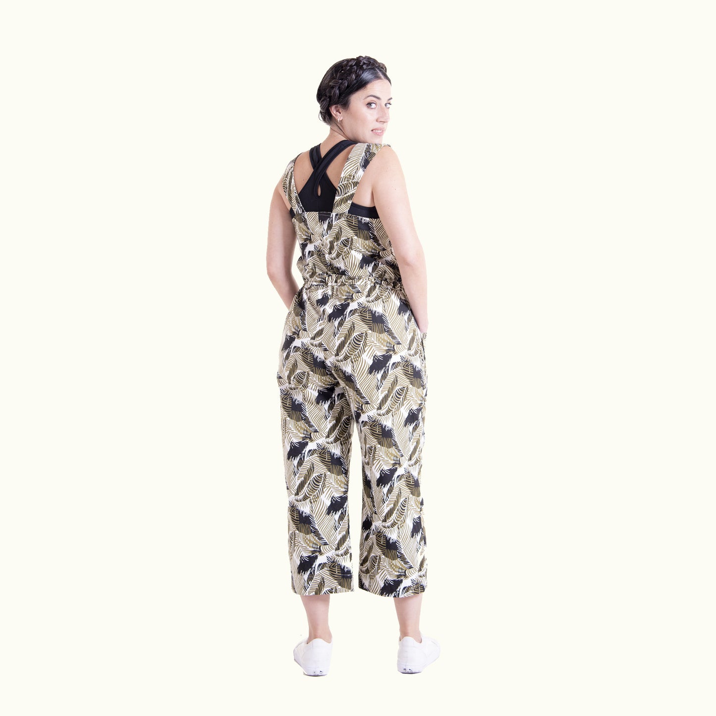 Back view of printed Juniper overall showing strap and pocket details