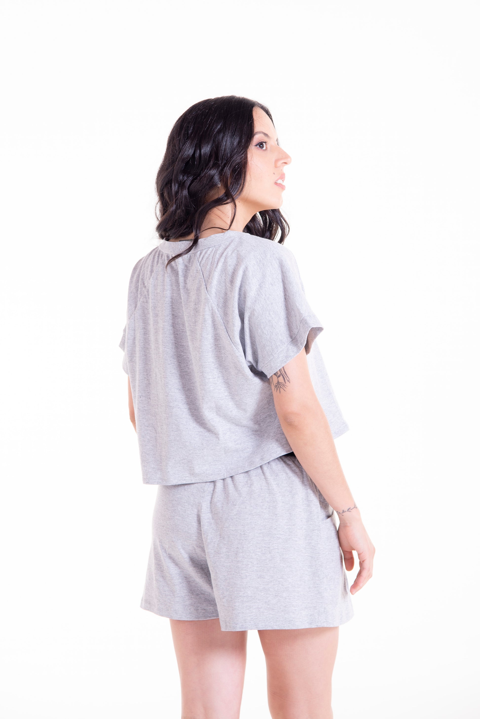 Back view of grey Willow raglan crop top showing cropped lengt