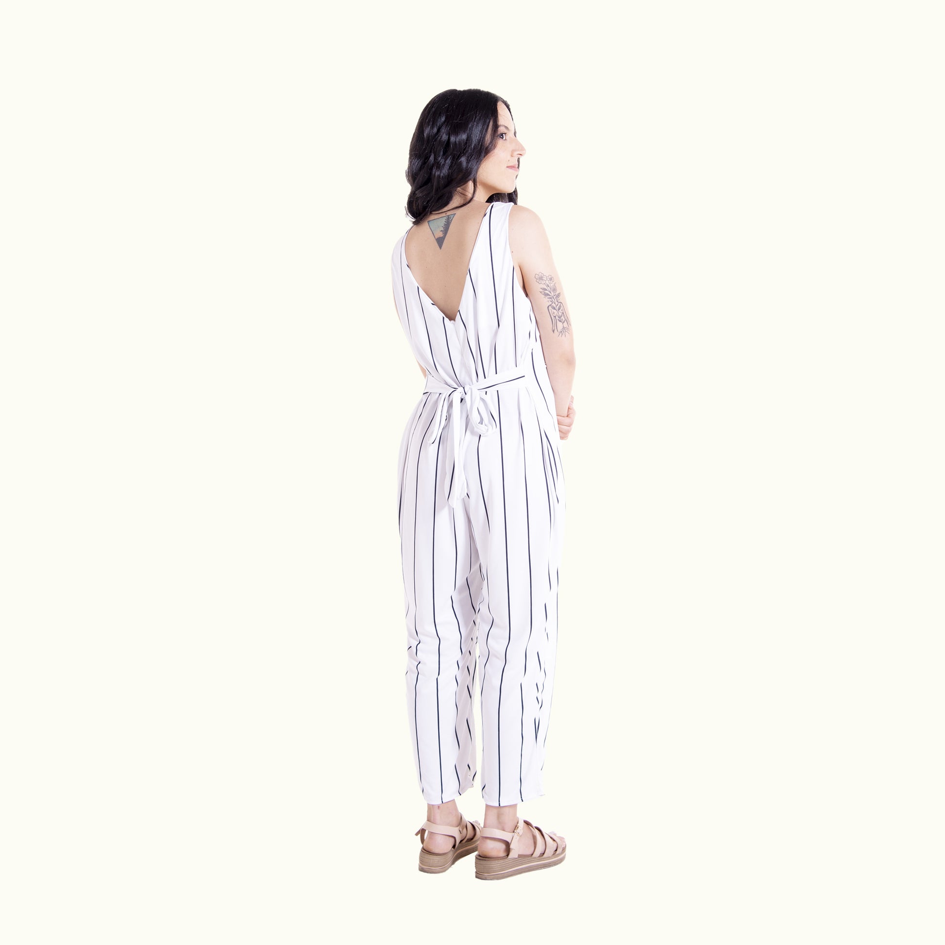 Back view of white striped Wisteria wrap jumpsuit long version showing wrap tie detail