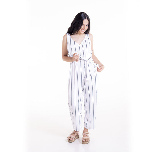 Woman wearing white striped Wisteria wrap jumpsuit long version - sewing pattern by The Bobbin Bloom