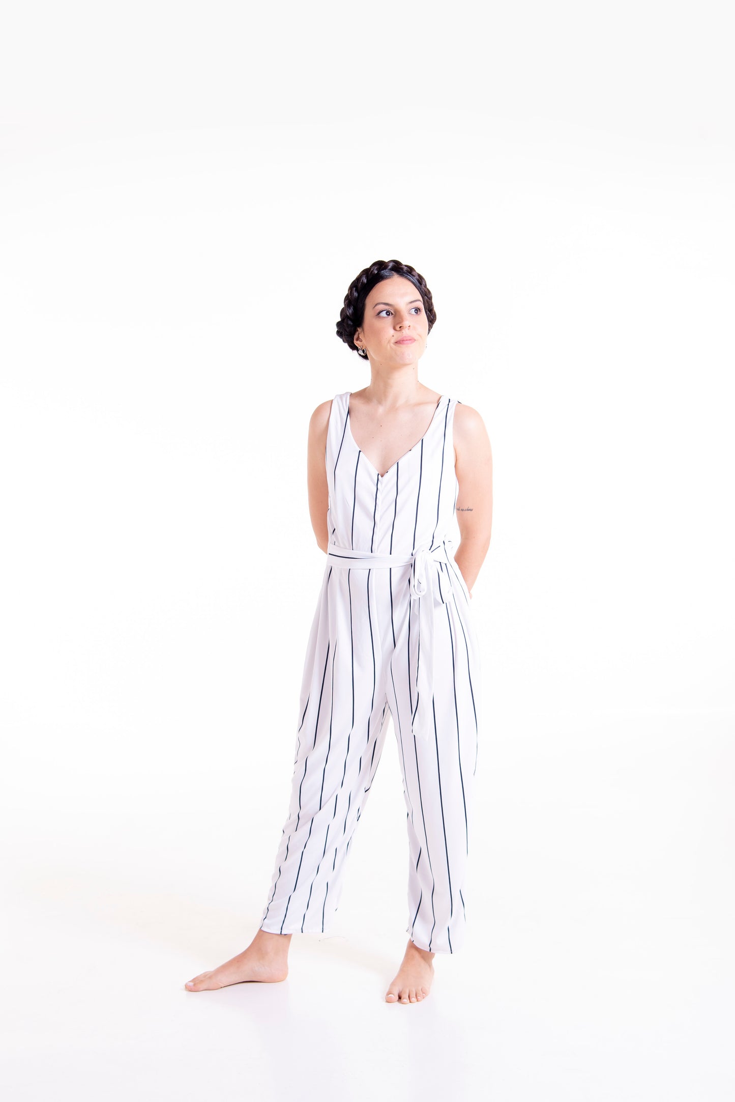 Front styled view of white striped Wisteria wrap jumpsuit long version