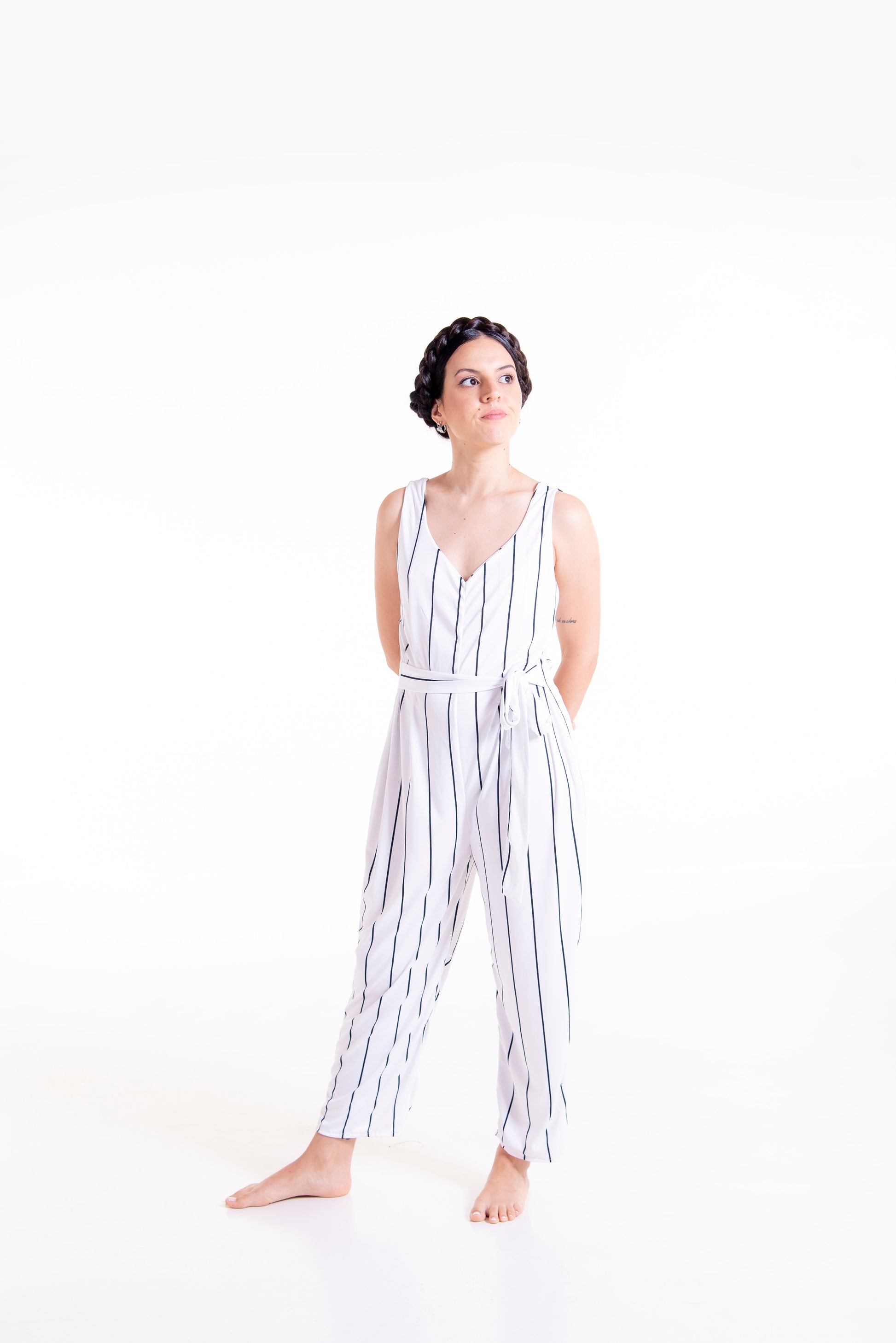 Front styled view of white striped Wisteria wrap jumpsuit long version